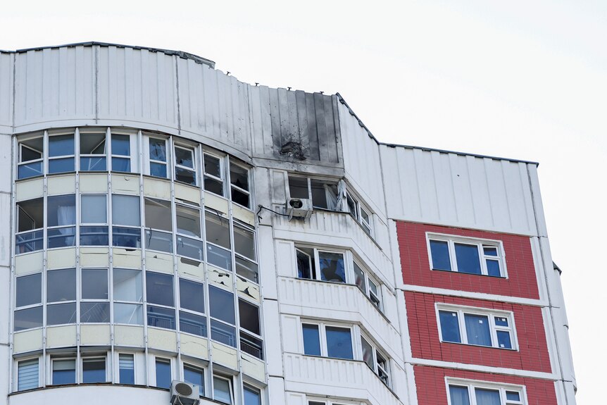 A damaged multi-storey apartment block following a reported drone attack in Moscow.