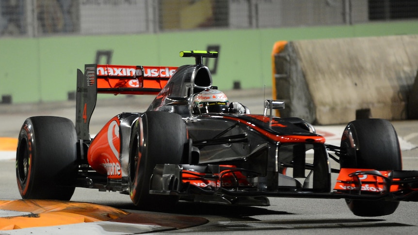 British driver Lewis Hamilton finished fastest to take pole position for the Singapore Grand Prix.