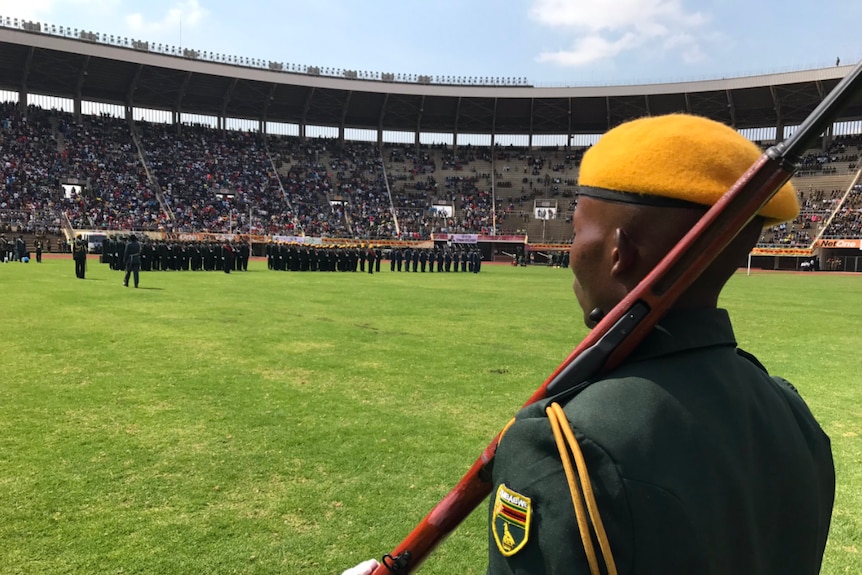 A soldier stands with a gun over his shoulder during a military parade at Emmerson Mnangawa's inauguration.