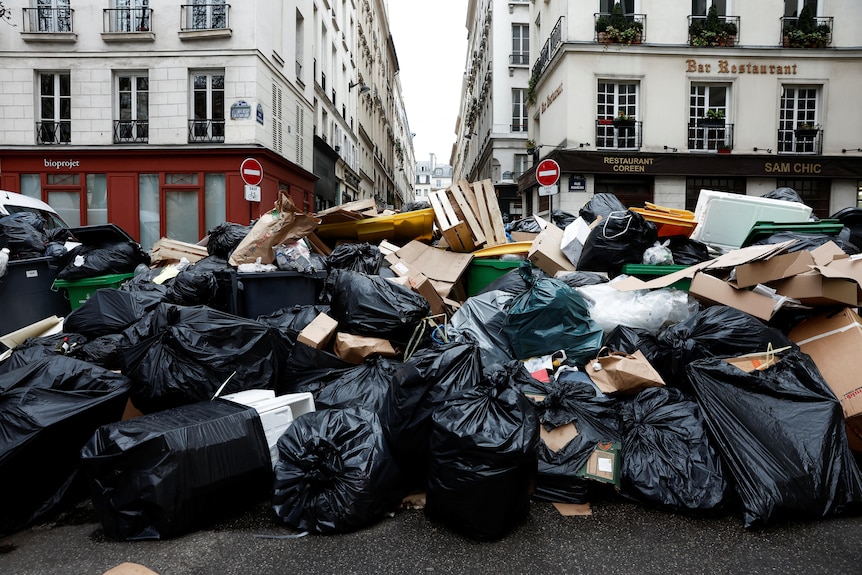 Piles of rubbish fill the streets.