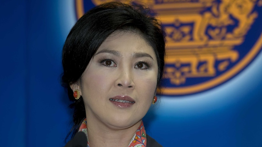 Yingluck Shinawatra answers questions from the media