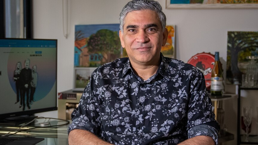 Sid Lal sits in his home office in Sydney in November 2021.