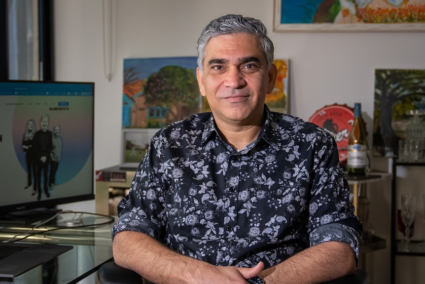 Sid Lal sits in his home office in Sydney in November 2021.
