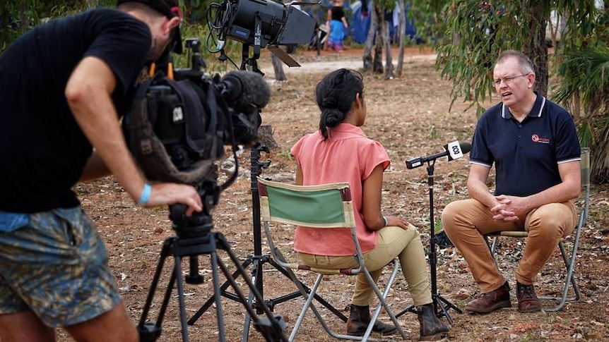 Cameraman Mitchell Woolnough filming journalist Avani Dias conducting an interview at Garma Festival.