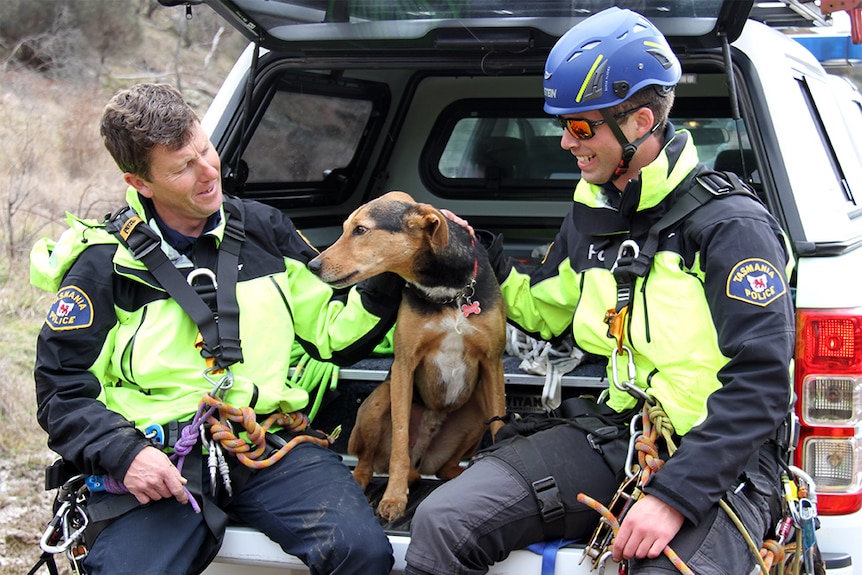 Ralphie sits in the back of a van with his police rescue team