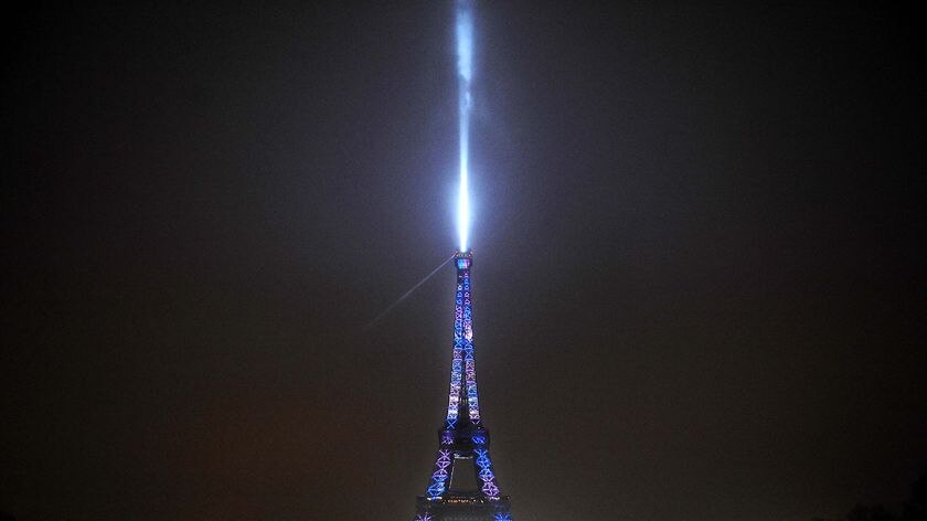 About 70,000 people gathered near the Eiffel Tower for a multicoloured light show.