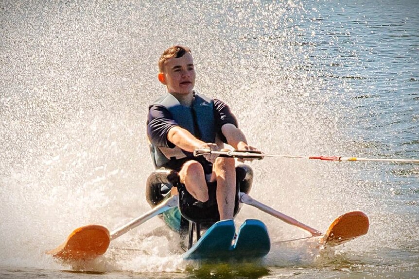 A man with one leg uses a seated water ski 