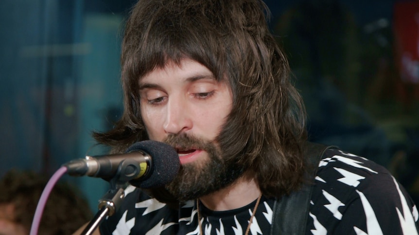 An image of Kasabian performing 'Can You Tell Me How to Get to Sesame Street?/Good Vibrations' 