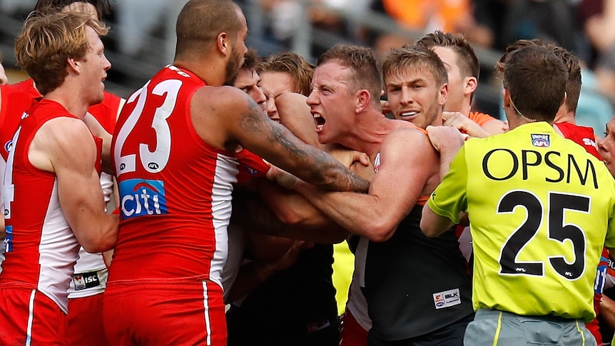Lance Franklin and Steve Johnson in a scuffle