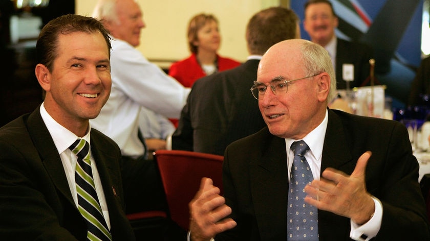 Ricky Ponting and John Howard share a story at the Australian World Cup team breakfast.