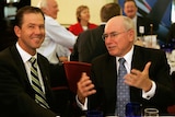 Ricky Ponting and John Howard share a story at the Australian World Cup team breakfast.