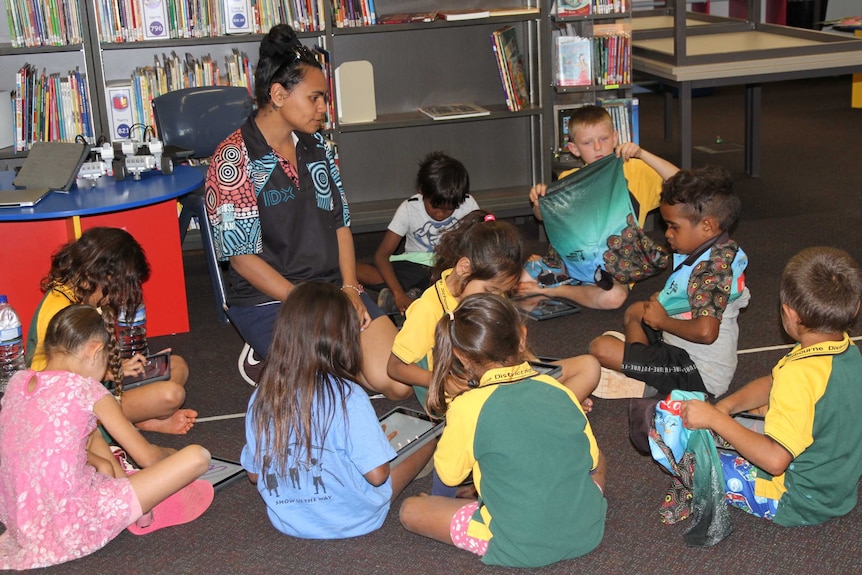 a young woman teaching kids