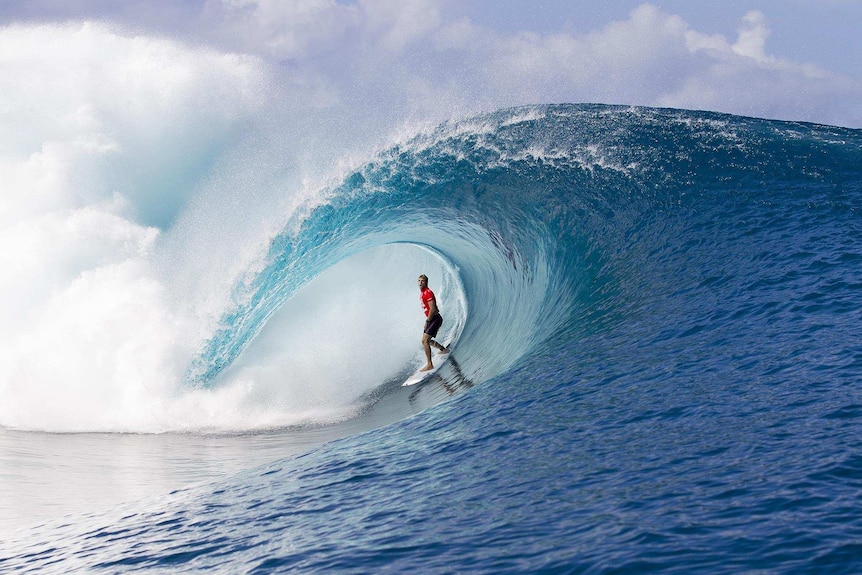 Mick Fanning charging Teahupoo in Tahiti