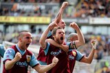 Emphatic win: Graham Alexander celebrates three points with his Burnley team-mates.