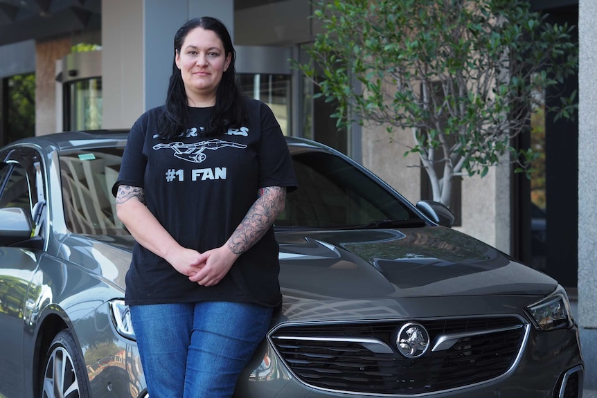 Cara Bertoli stands in front of her new Holden Commodore