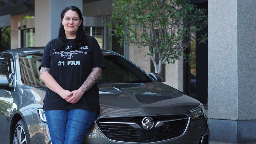 Cara Bertoli stands in front of her new Holden Commodore