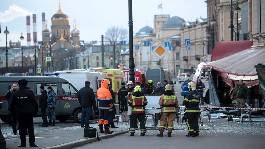 Russian Emergency Situations Ministry stand at the side of an explosion at a cafe in St. Petersburg, Russia,