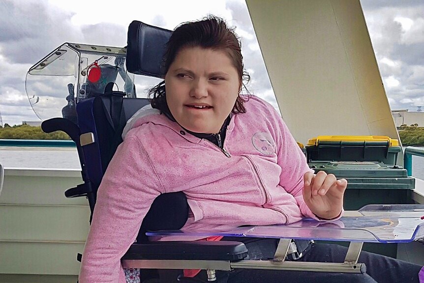 A teenage girl in a wheelchair