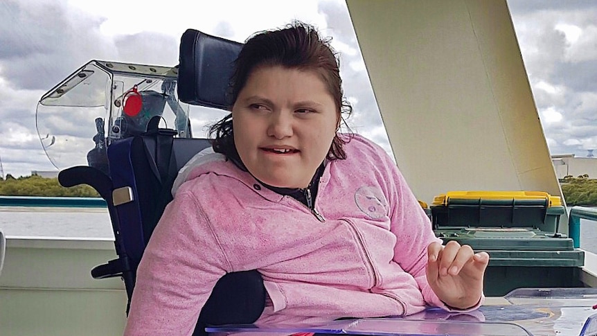A teenage girl in a wheelchair