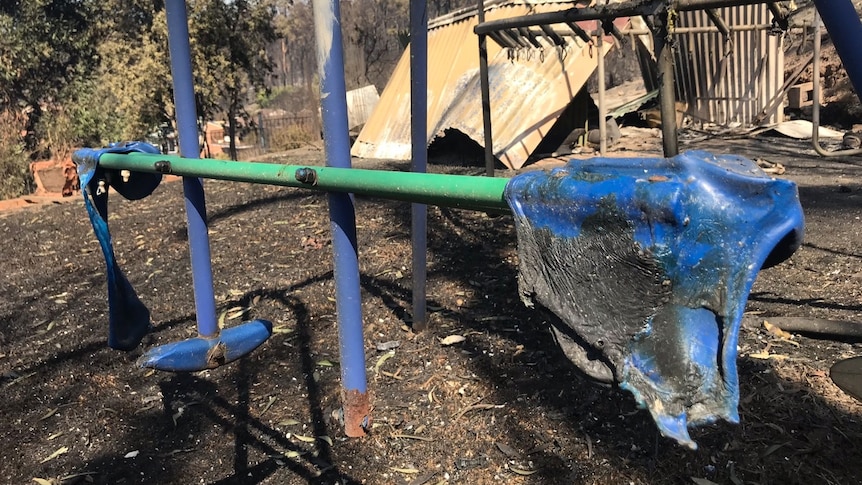 A blue seat, which has been melted by fire.
