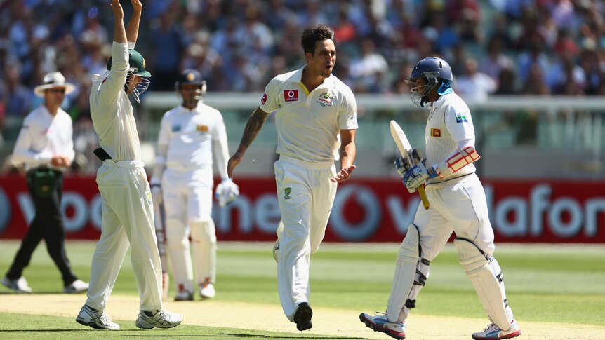 Bowled him ... Mitchell Johnson celebrates after cleaning up Tillakaratne Dilshan's stumps.