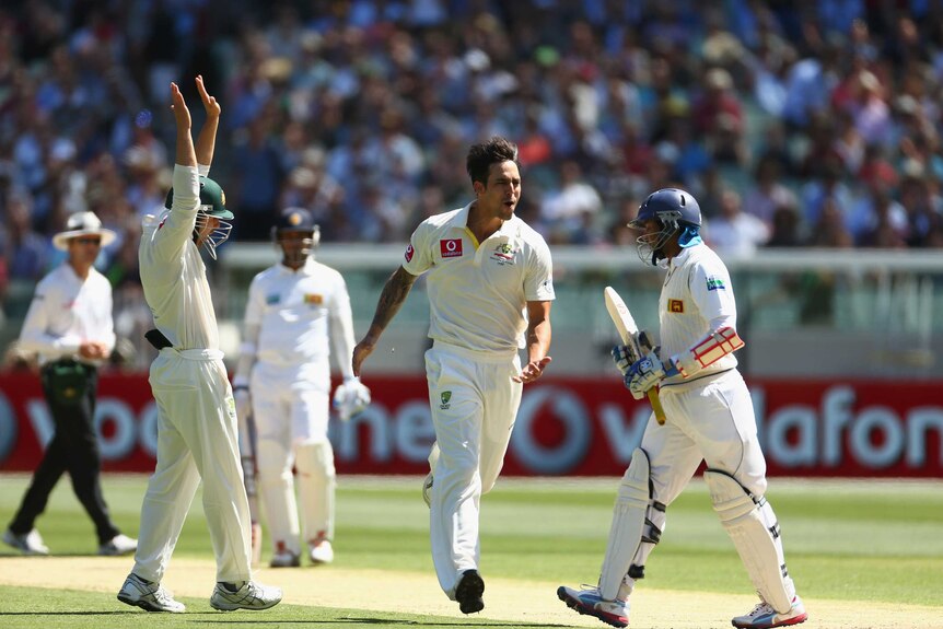 Bowled him ... Mitchell Johnson celebrates after cleaning up Tillakaratne Dilshan's stumps.