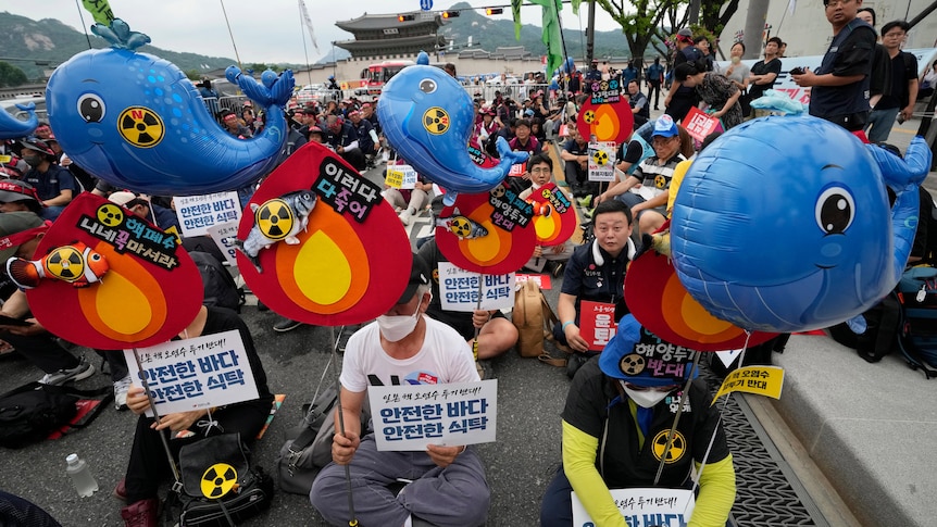 Protesters stage a rally against the Japanese government's decision to release treated radioactive water.