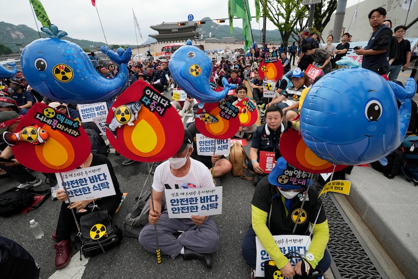 Protesters stage a rally against the Japanese government's decision to release treated radioactive water.