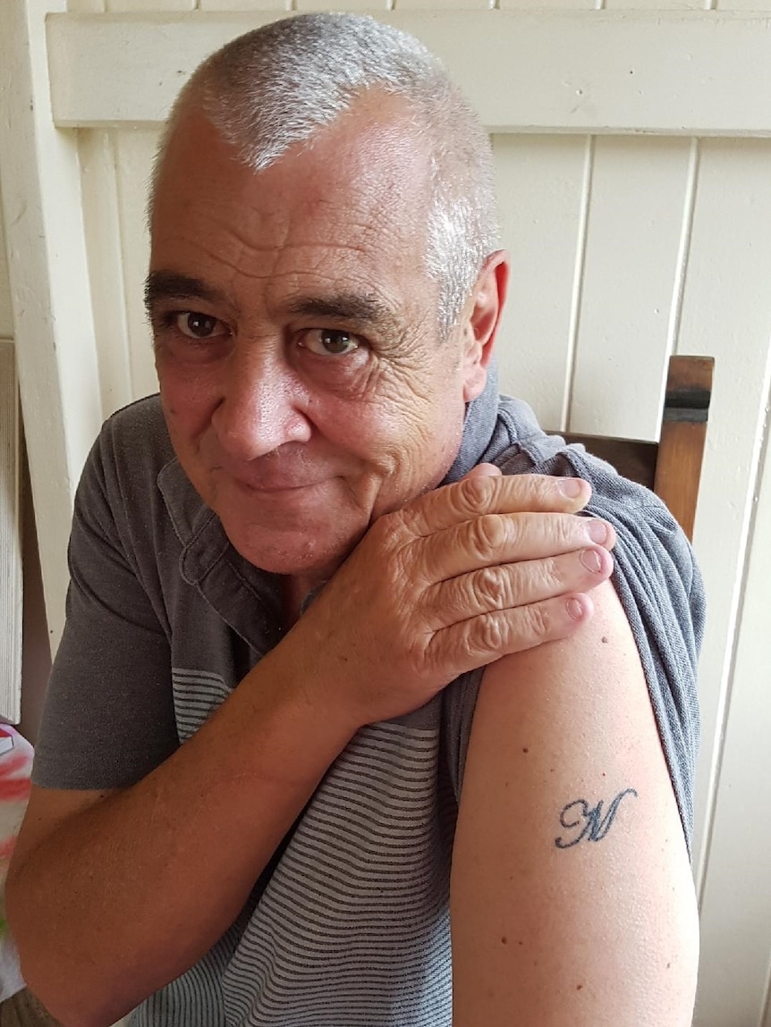 John Sandeman had M for Mason tattooed on his arm