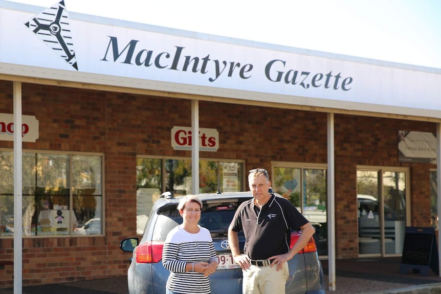 Heidi and Lester Dawson stand on the street out the front of their office in Texas, Southern Queensland May 2020.