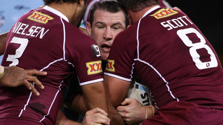 Paul Gallen of the Blues takes on the defence during game one of the ARL State of Origin 2011.