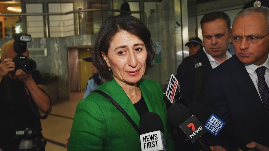 Gladys Berejiklian surrounded by media