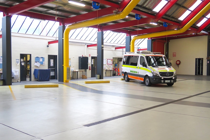 One ambulance parked inside Ambulance Tasmania depot.