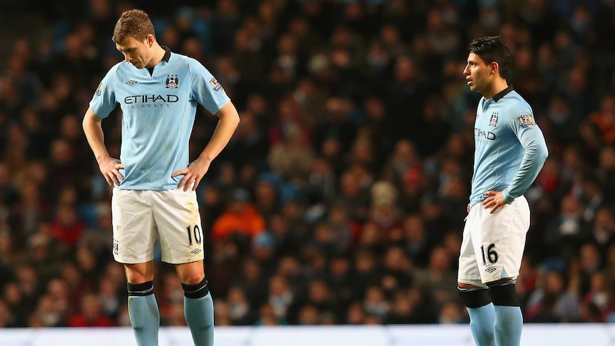Mixed fortunes ... Edin Dzeko and Sergio Aguero (R) look dejected after City conceded its second goal