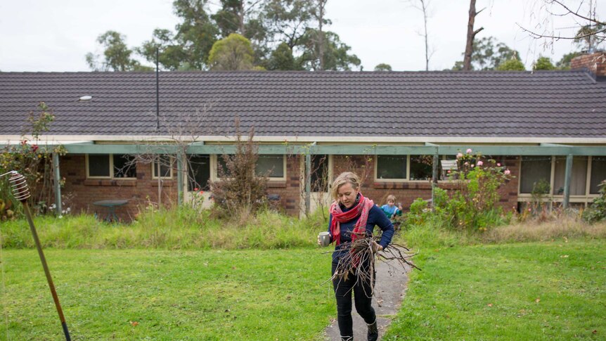 Sarah Smethurst collects kindling for her wood oven.