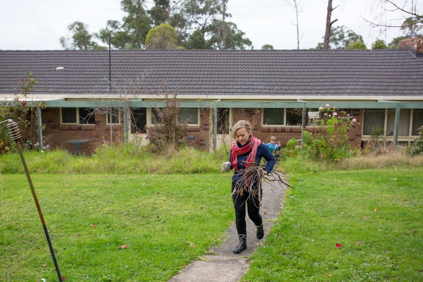 Sarah Smethurst collects kindling for her wood oven.