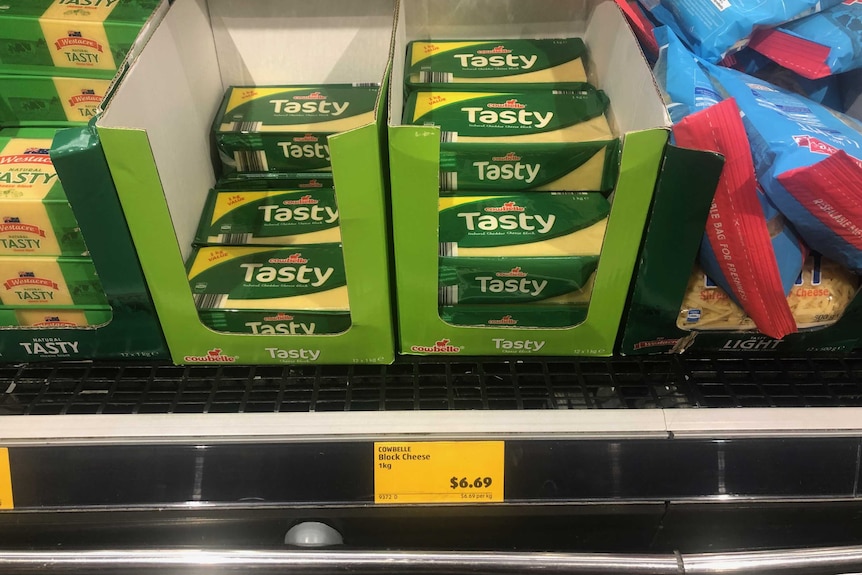 Cheap blocks of cheese for sale on the shelves of ALDI.