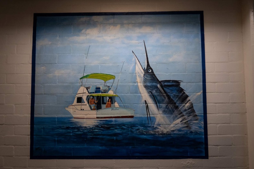 Painting of a man and woman in a boat fishing with a marlin the foreground
