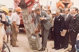 Prime Minister Malcom Fraser pouring the first concrete for Parliament House, November 1981.
