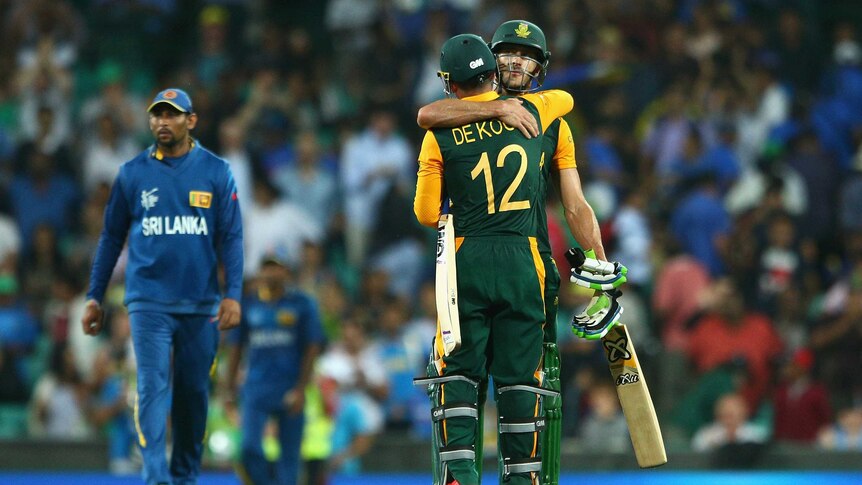Well done ... Faf du Plessis and Quinton de Kock embrace after hitting the winning runs
