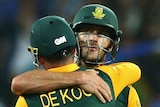 Well done ... Faf du Plessis and Quinton de Kock embrace after hitting the winning runs