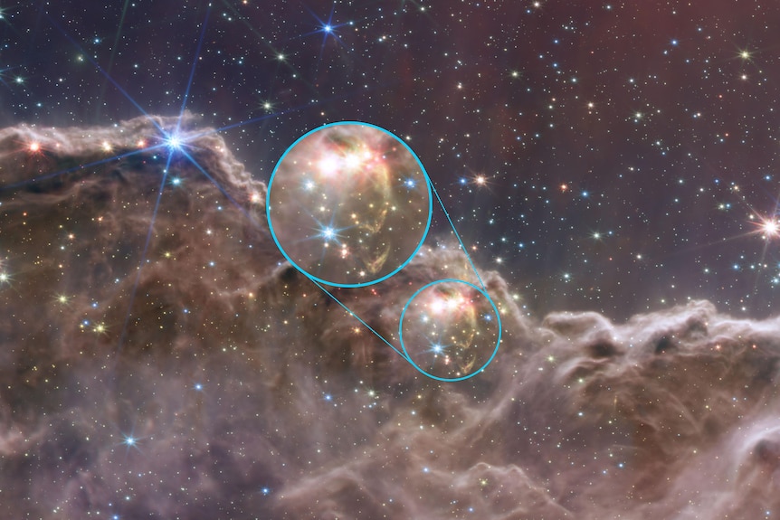 A voluminous dust cloud is highlighted in and magnified in an image of the carina nebula.