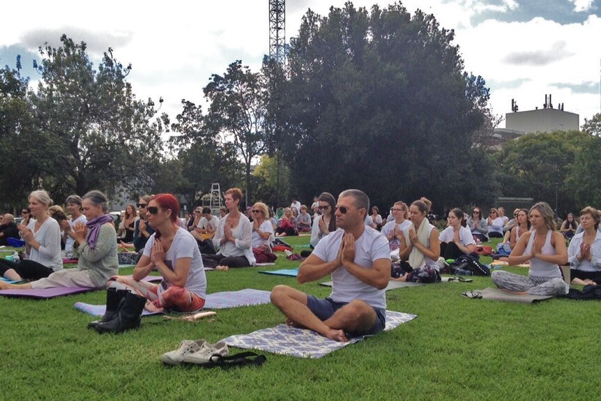 Yoga participants on their mats in an Adelaide park