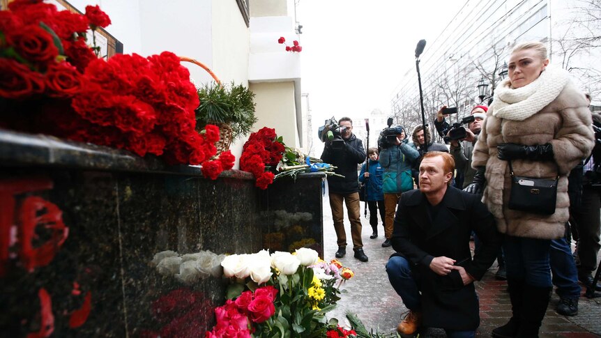 Mourners lay flowers for Russian plane crash victims