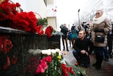 Mourners lay flowers for Russian plane crash victims