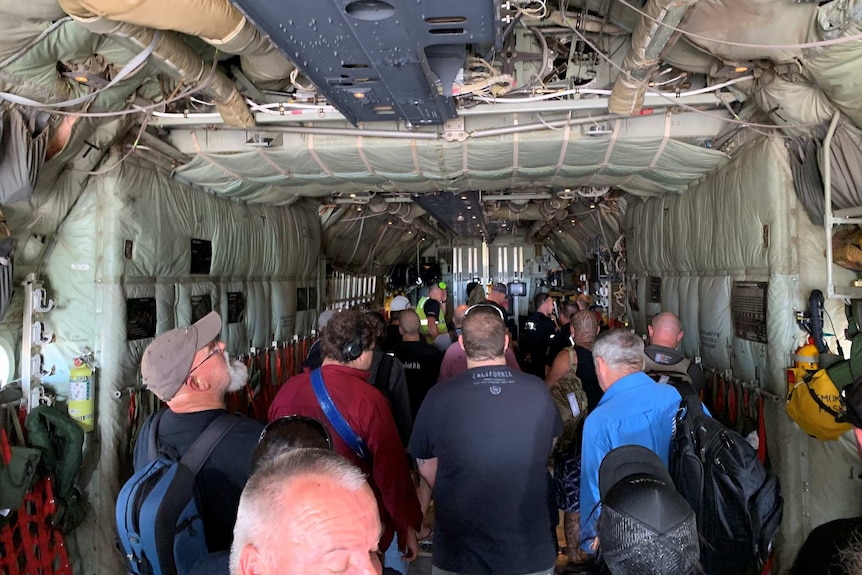 Workers from the mine in a Hercules.