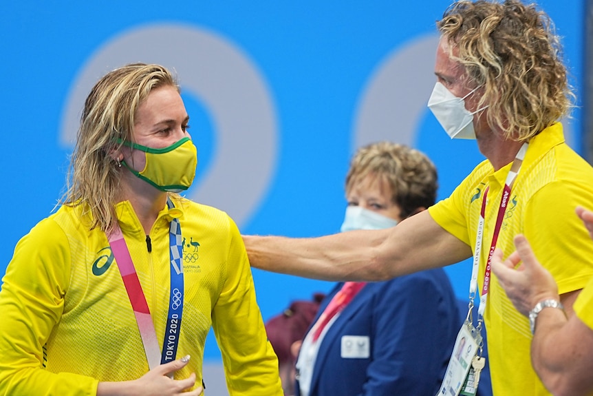 Ariarne titmus and Dean Boxall look at each other