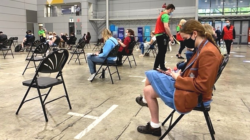 People waiting for vaccination at the Brisbane convention centre