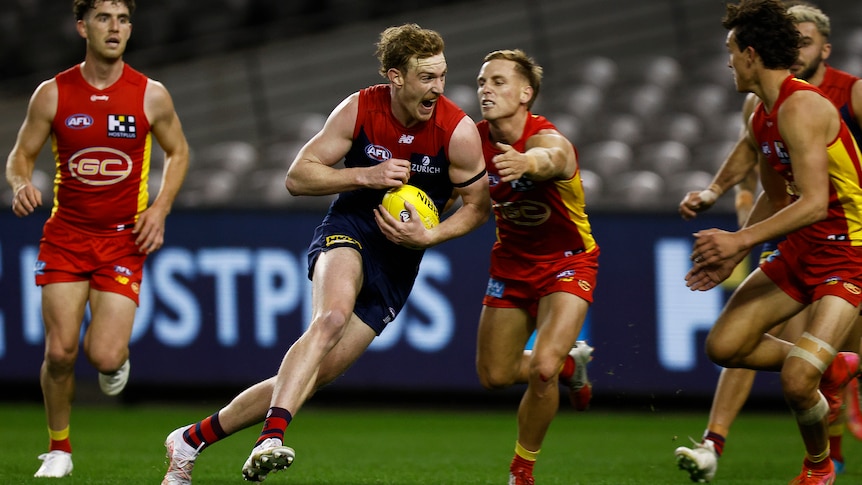 A footballer escapes his opponents