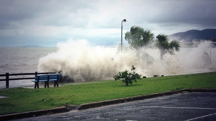 A storm surge hits Airlie Beach in north Queensland.